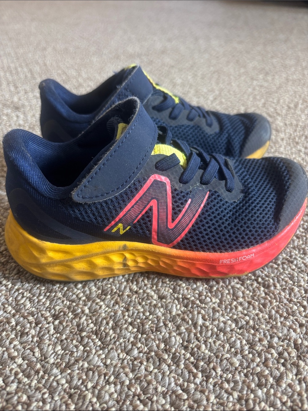 New Balance Kids Navy Blue Sneakers with Yellow & Orange Accents